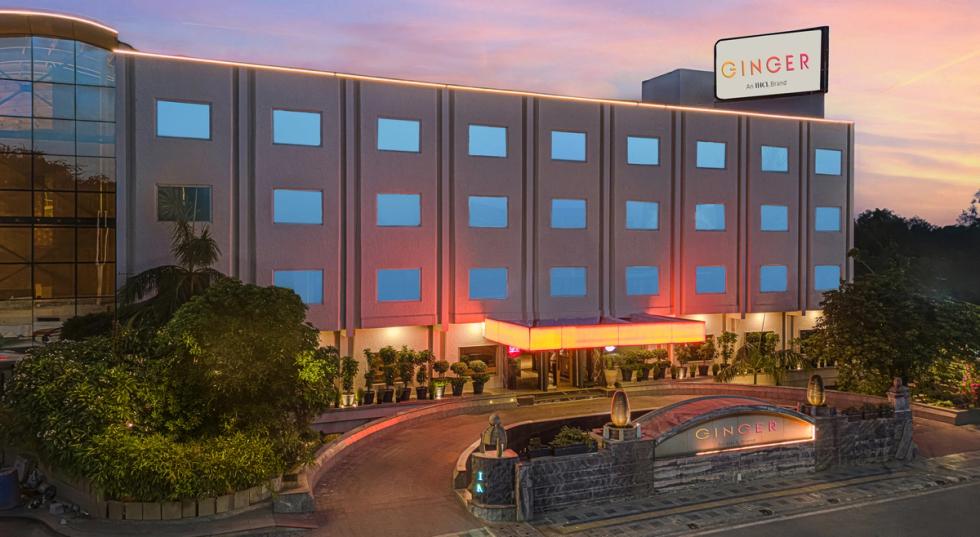 Exterior view of the hotel building at dusk at Ginger Agra, Fatehabad Road.