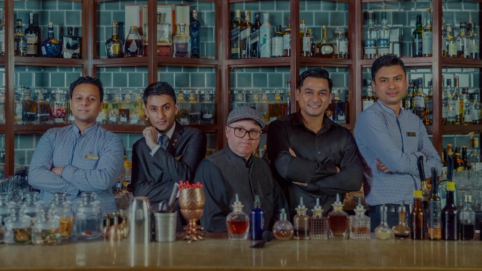 IHCL bartenders behind the bar counter