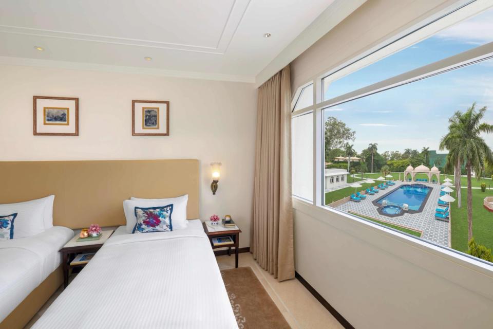 Deluxe Twin Bed Room with Pool View at Tajview Agra