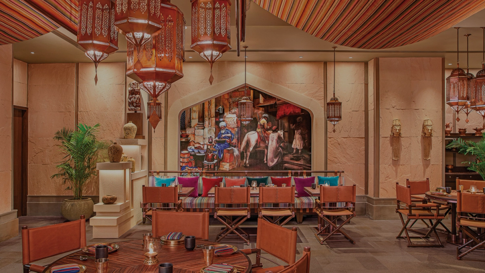Elegant restaurant interior with lantern lighting and wooden furniture