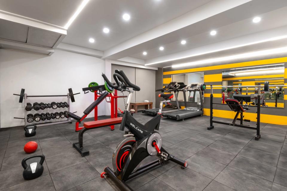 Fitness center equipped with treadmills, weight benches, and free weights in Bari Brahmana, Jammu.