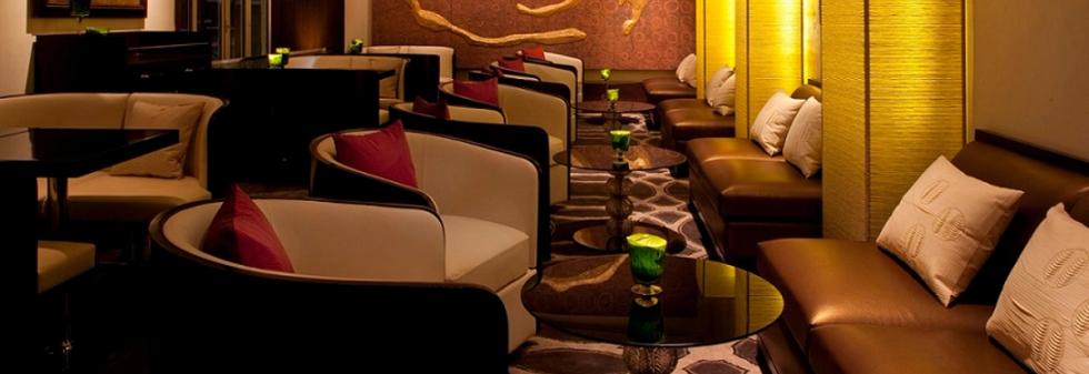 Interior of Harbour Bar with elegant seating, warm lighting, and a stylish bar counter