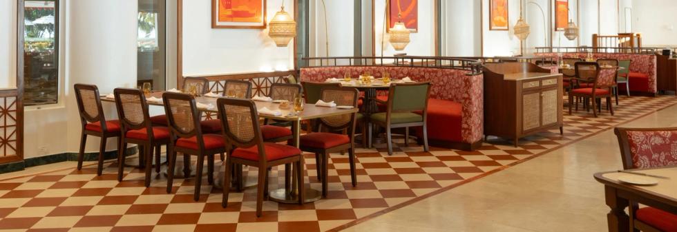 Restaurant interior with symmetrical arches and neatly arranged tables