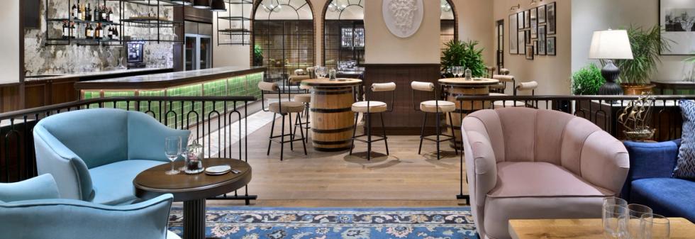 Restaurant lounge with bar seating and soft lighting