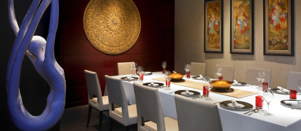 Private dining space with formal table setting