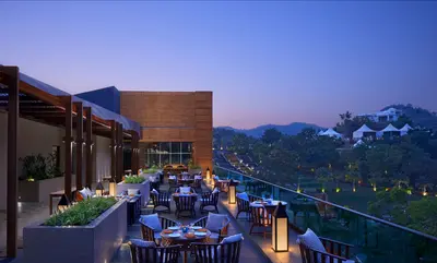 Open Fine Dining Restaurant with a Night View at Taj Aravali Resort & Spa