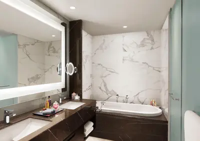 Luxurious bathroom interior with modern amenities at Taj Wellington Mews, Chennai.