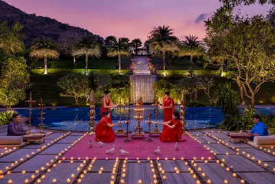 " Taj Aravali Resort & Spa Staff Lighting Diyas at Night"