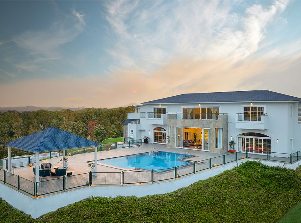 The Holland House, Nashik - amã Stays & Trails: Exterior view with swimming pool.