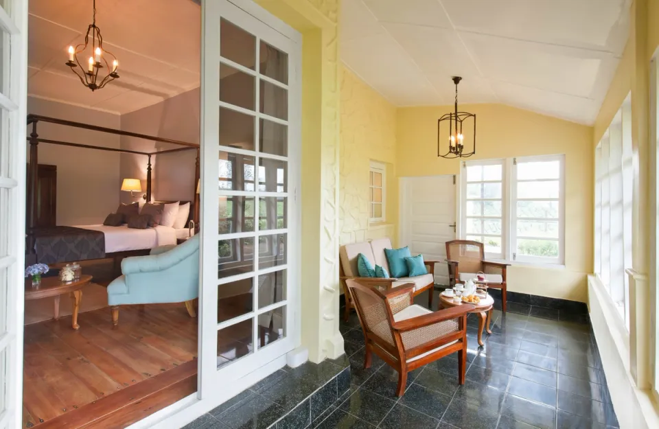 Bedroom With A Balcony at Sevenmallay Bungalow, Munnar - amã Stays & Trails 