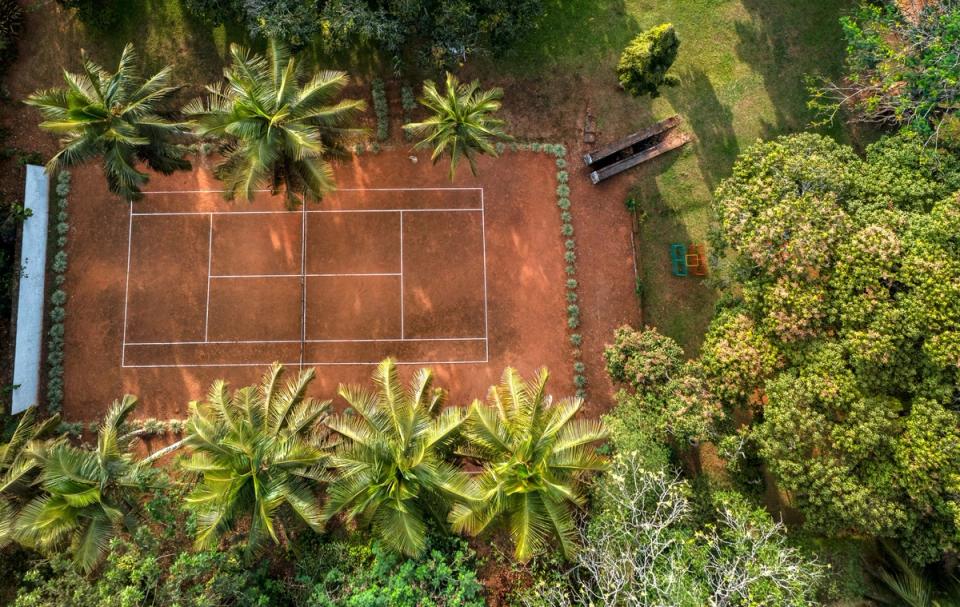 Outdoor Badminton Court at Taneerhulla Bungalow, Coorg- amã Stays & Trails 