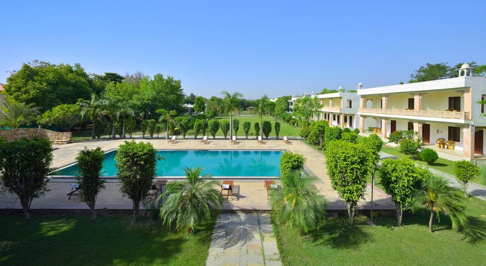 Modern facade and landscaped lawns at Ginger Ranthambore, Sawai Madhopur hotel.