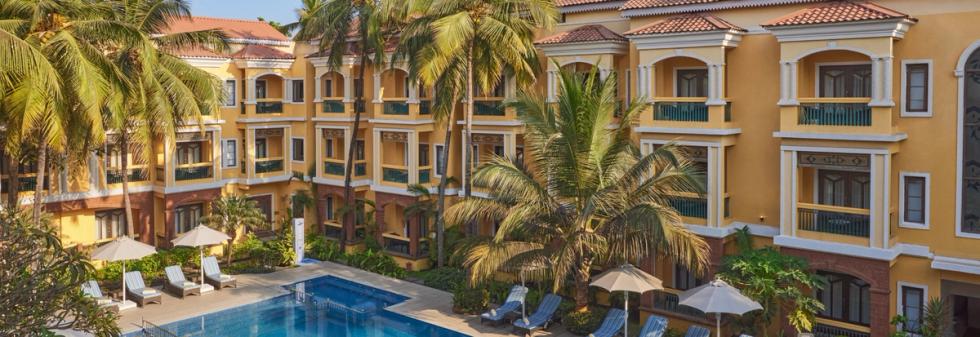 Pool with Relaxation chairs at La Estoria Goa - IHCL SeleQtions