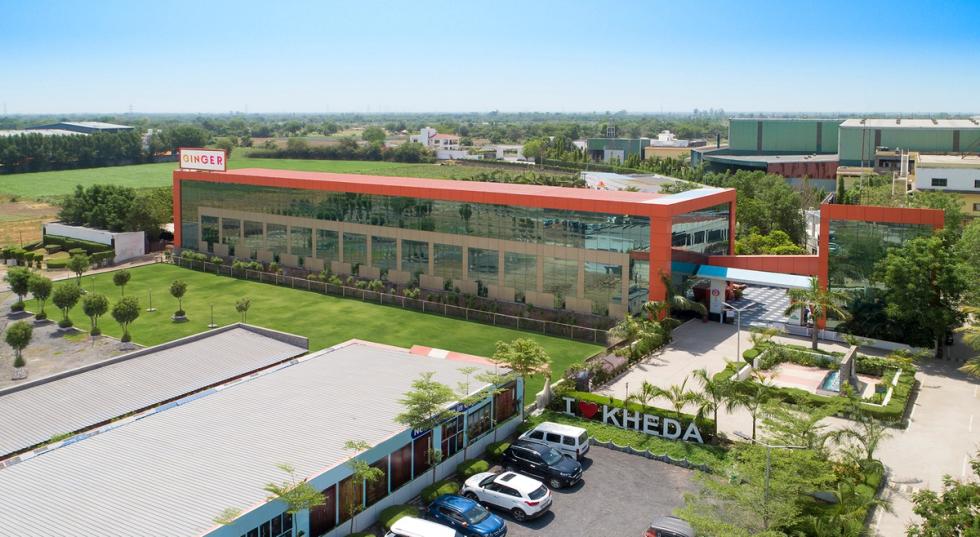 Exterior of Ginger Kheda, Dholka, a Lean Luxe hotel on the highway featuring a large marriage garden and event lawn.