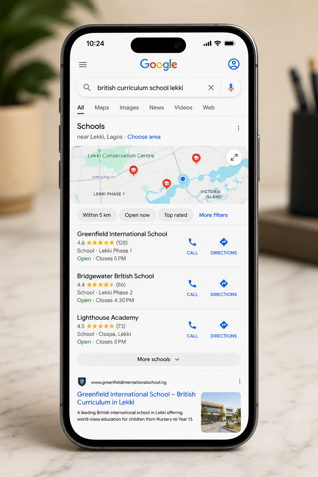 Parent comparing private schools in Lagos through local search results.