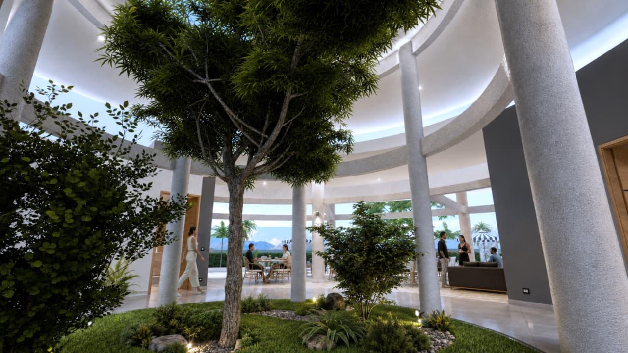 Atrio central de la casa club con jardín interior