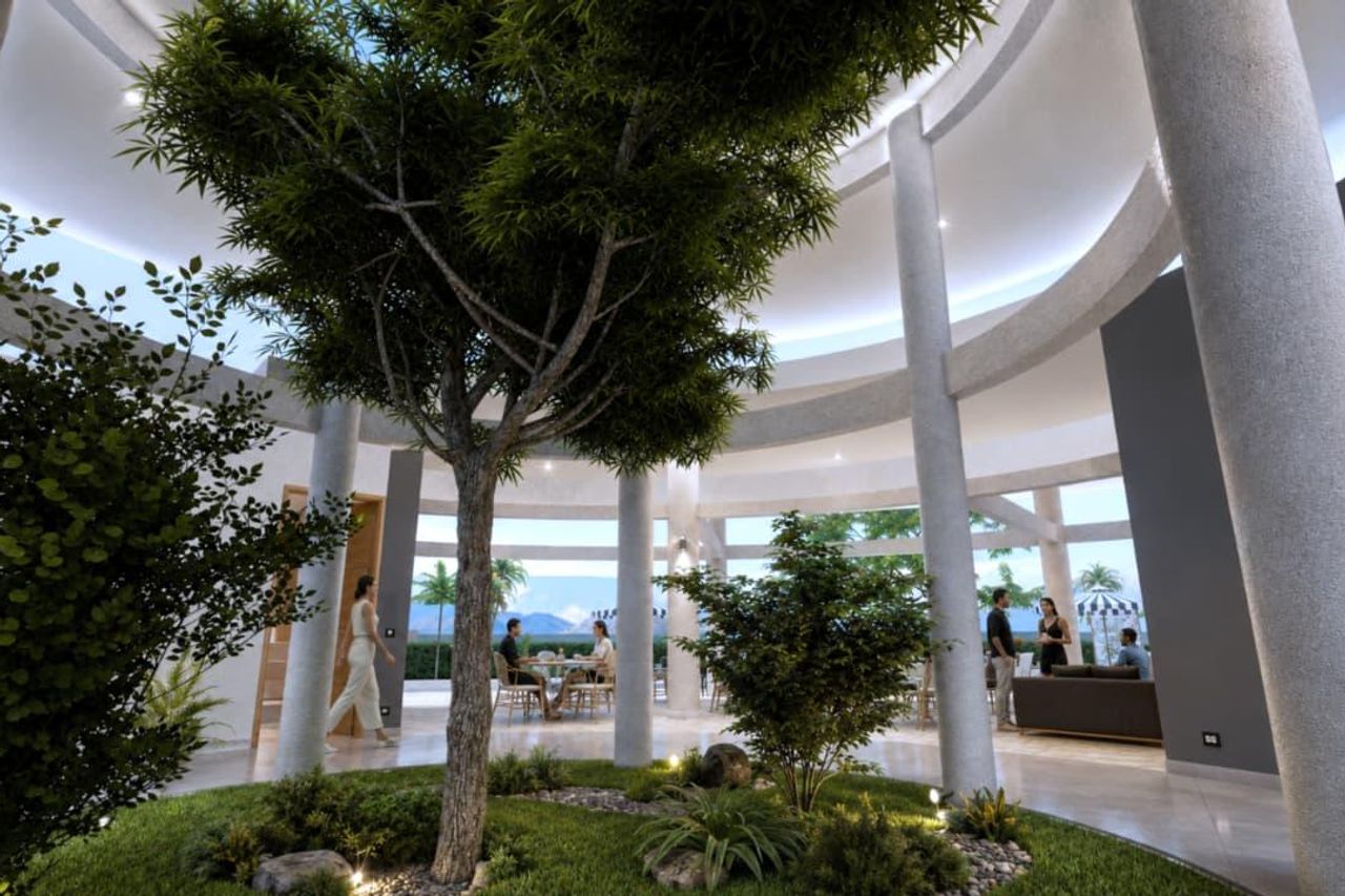 Atrio central de la casa club con jardín interior