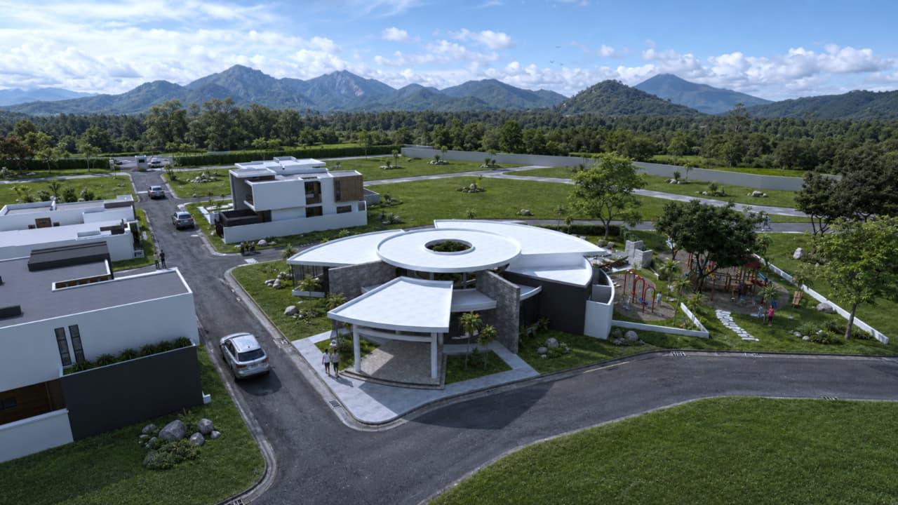 Vista aérea de la casa club, las casas modelo y el parque infantil