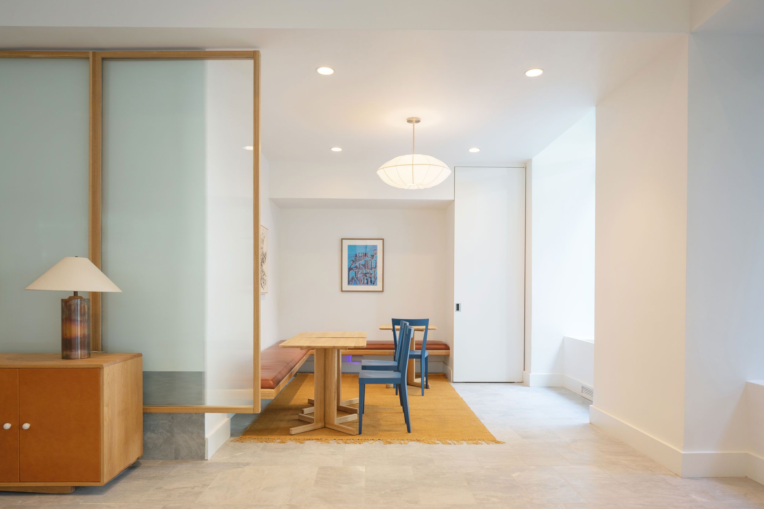 seating area with tables in building lobby