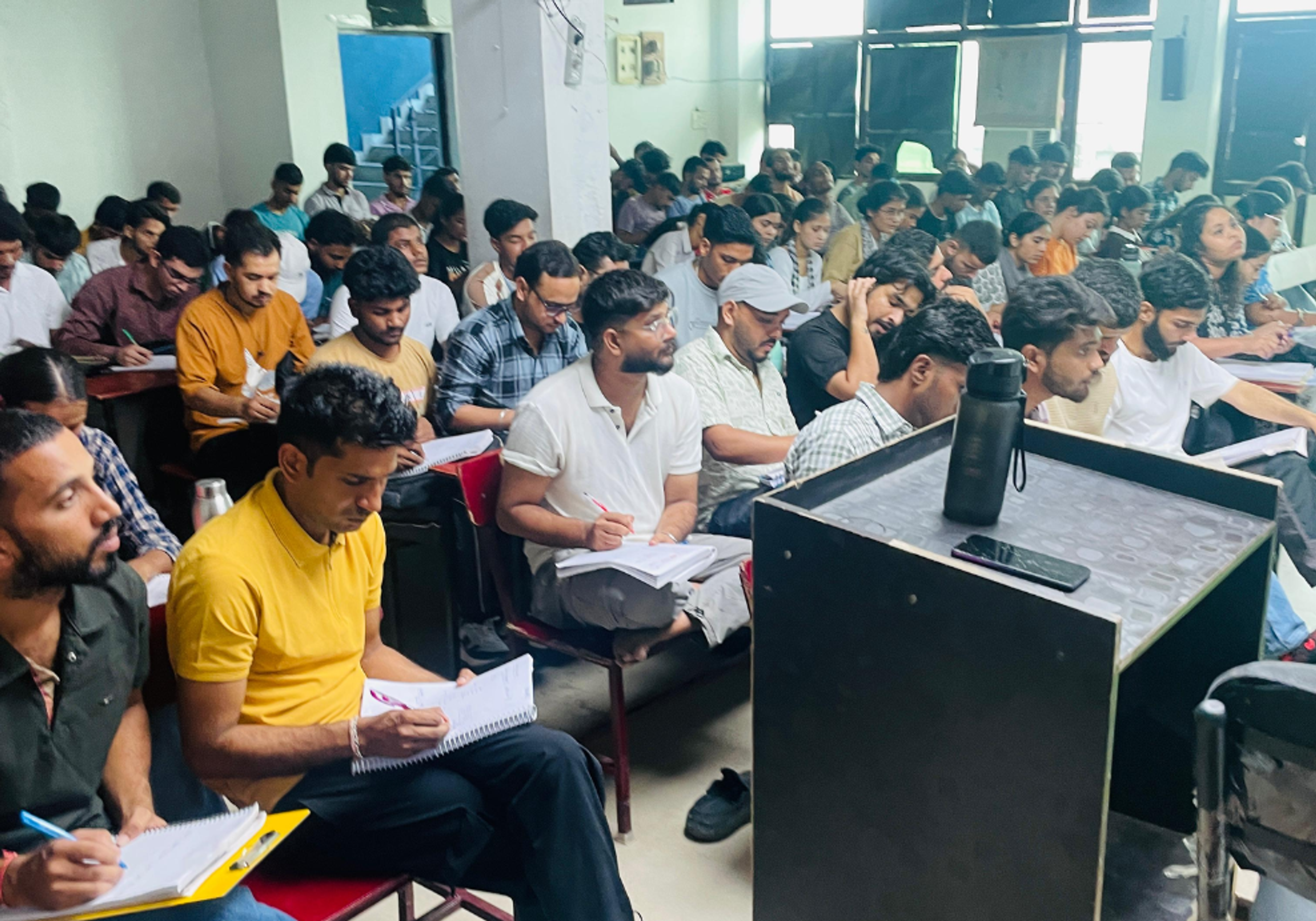 Students studying together at AIM Campus