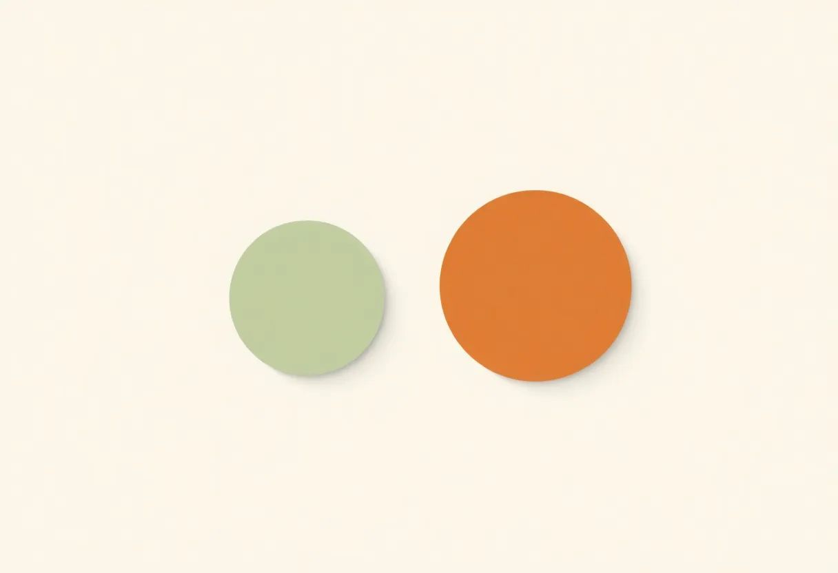 A minimal flat illustration of two solid circles arranged in a row: a smaller sage-green circle on the left, followed by a larger clay-terracotta circle on the right, separated by open space, representing a clear step-by-step order.