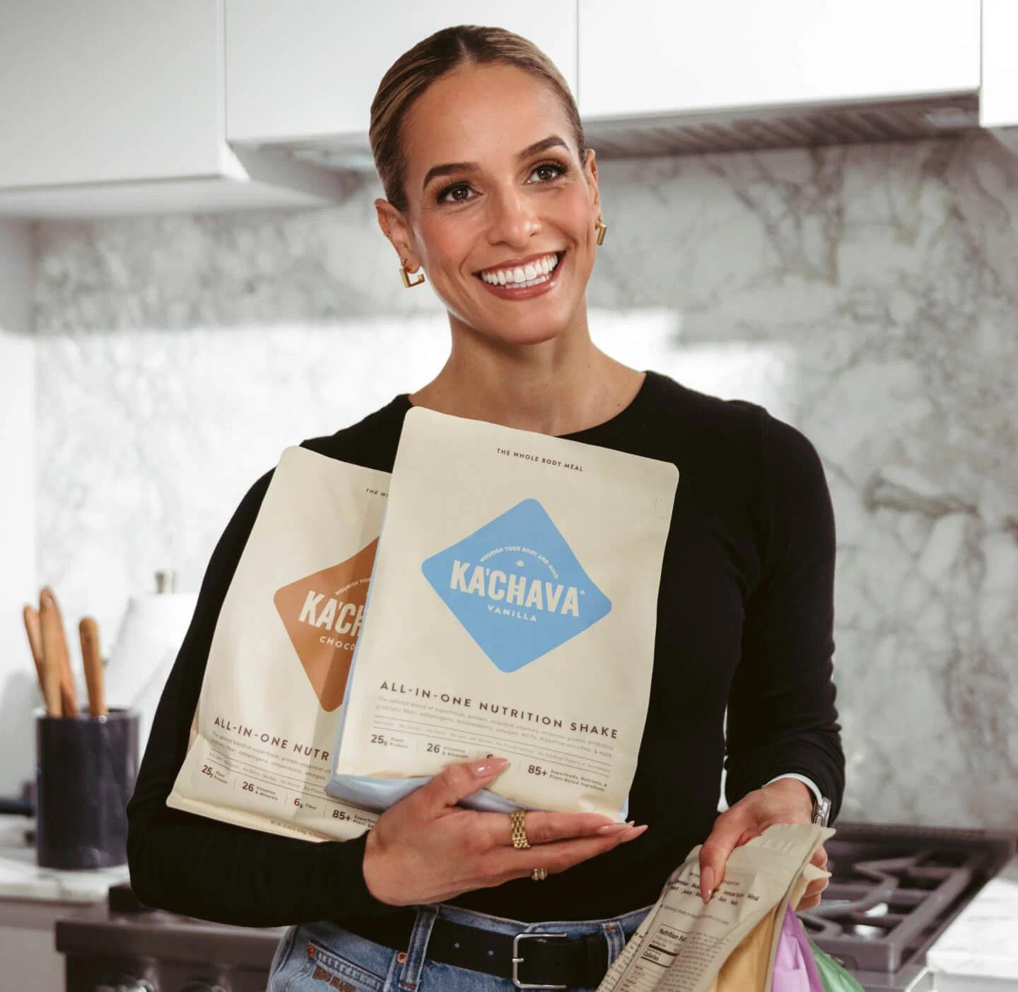 Jess Sims holding Ka'Chava bags in vanilla and chocolate flavors.