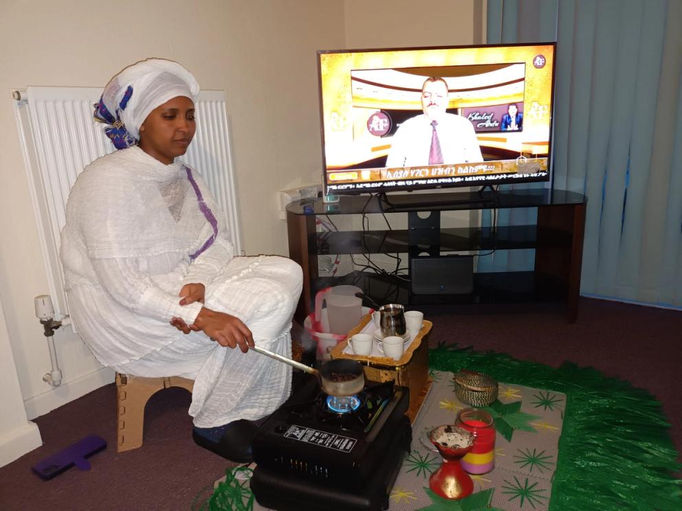 The situation at home is so hard and painful that when  we can, we try to relax as a family, just having coffee  together and trying not to think about the war. But the  TV is on in the background, so we are listening to the  news by an Eritrean journalist based in Sweden. Alem  and Selam Gebre