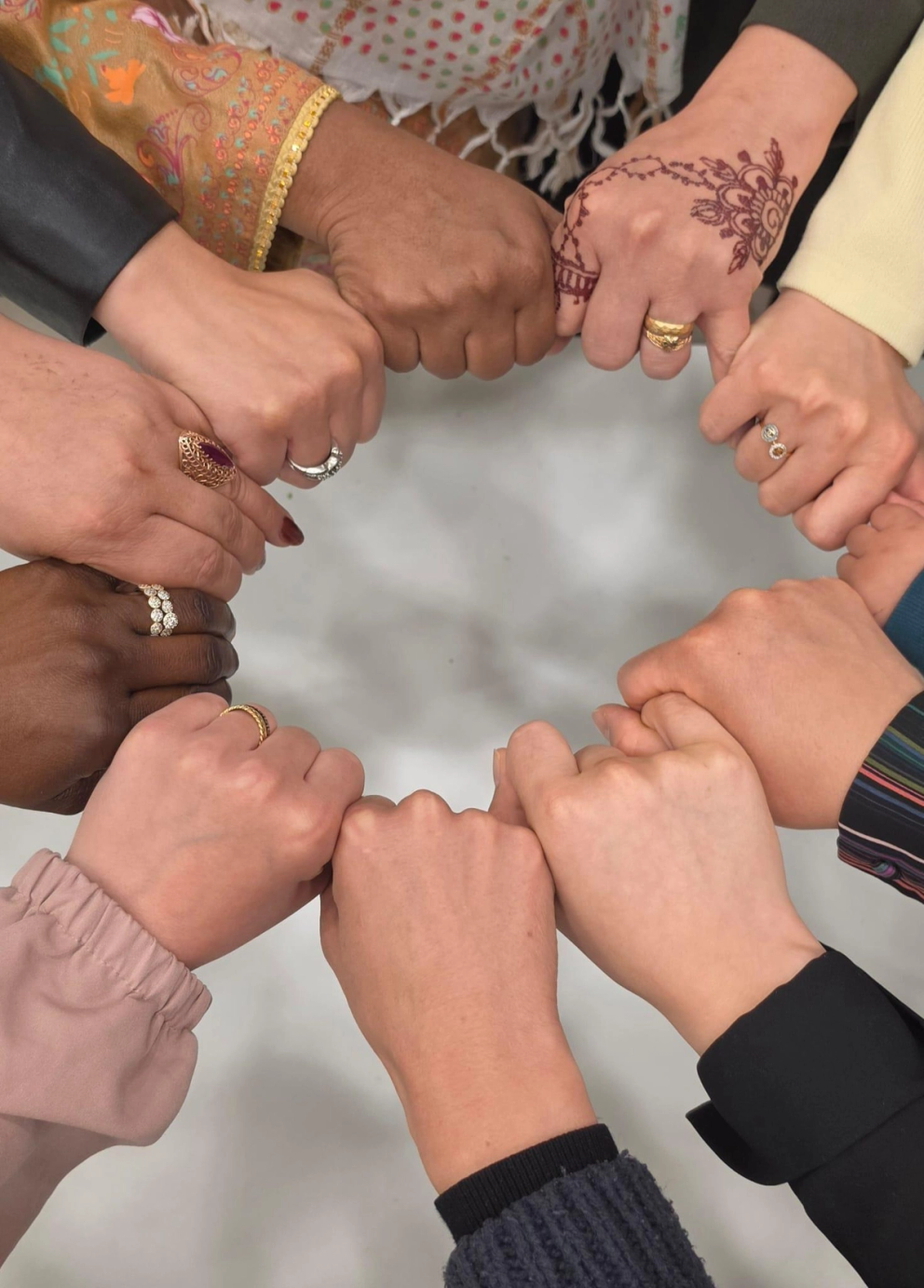 An image of hands united in a circle