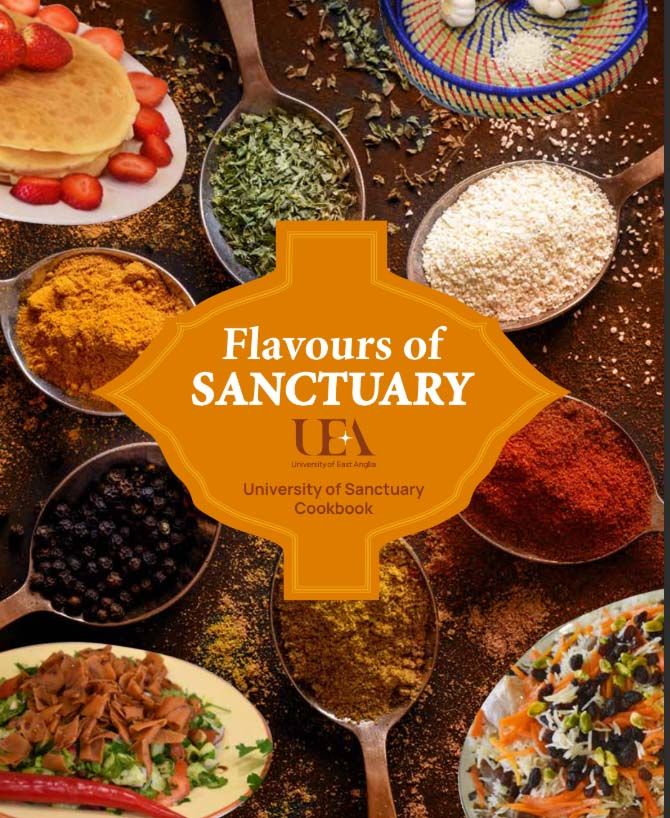 The front cover of a cookbook called Flavours of Sanctuary. The cover shows herbs, spices and several international dishes