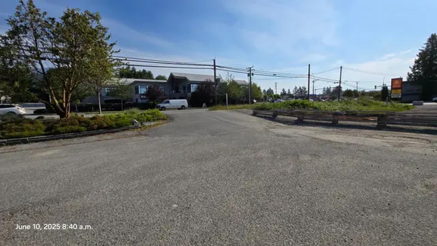 The gravel parking lot at Gibsons Way before reconstruction