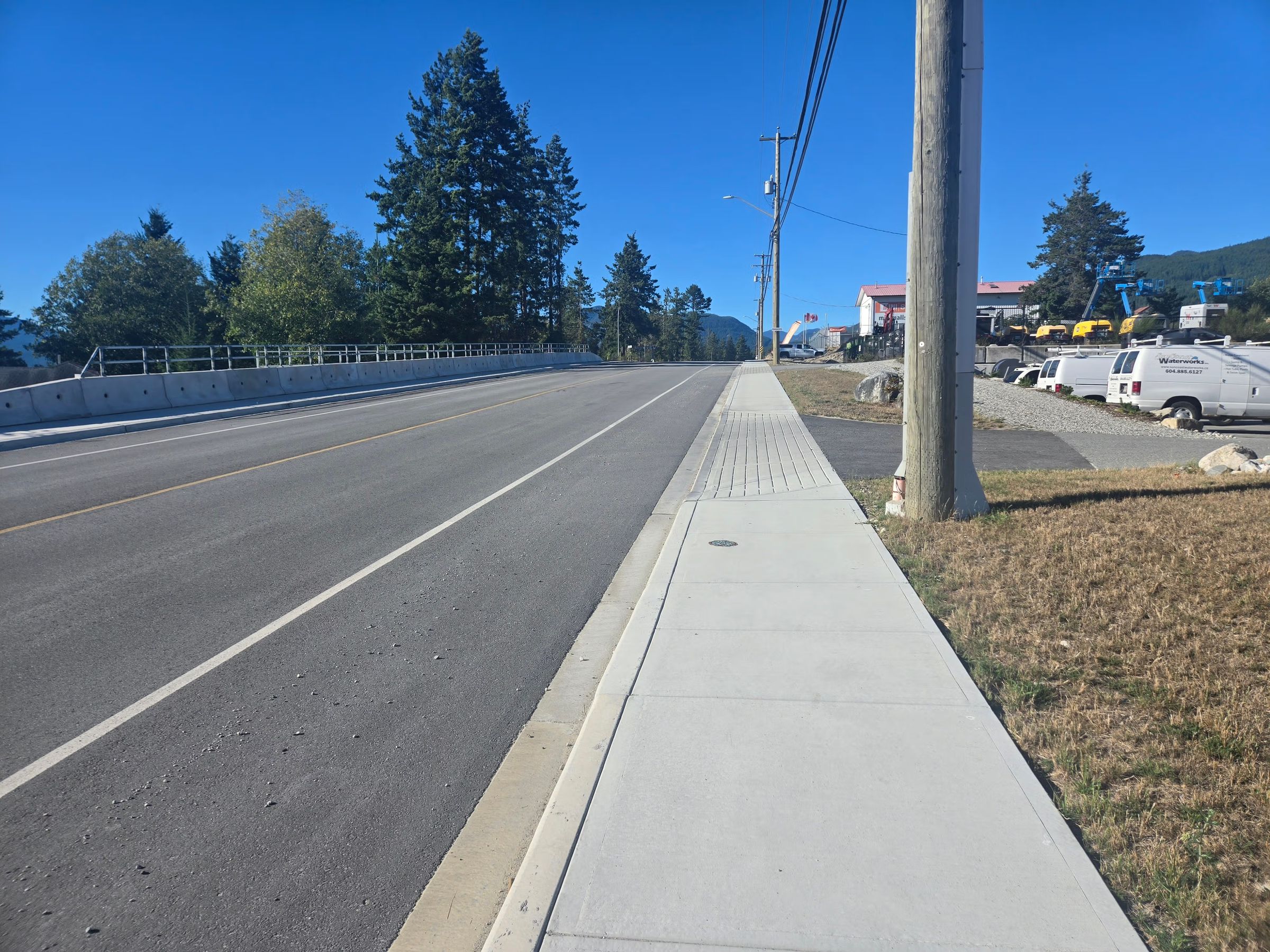 Newly paved road and concrete sidewalk on the Sunshine Coast