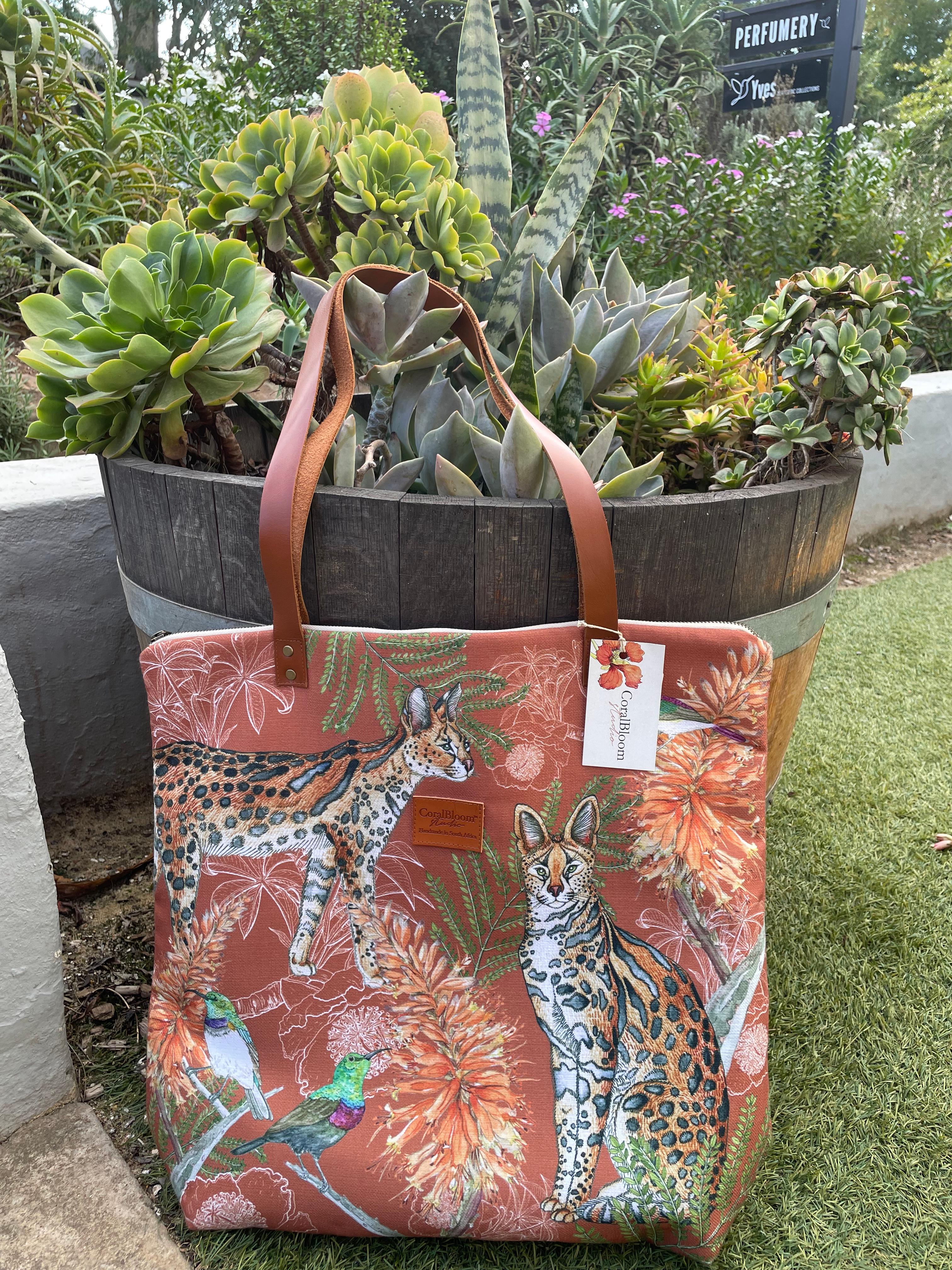 Terracotta CoralBloom luxury tote bag printed with a watercolour serval, aloes and a sunbird