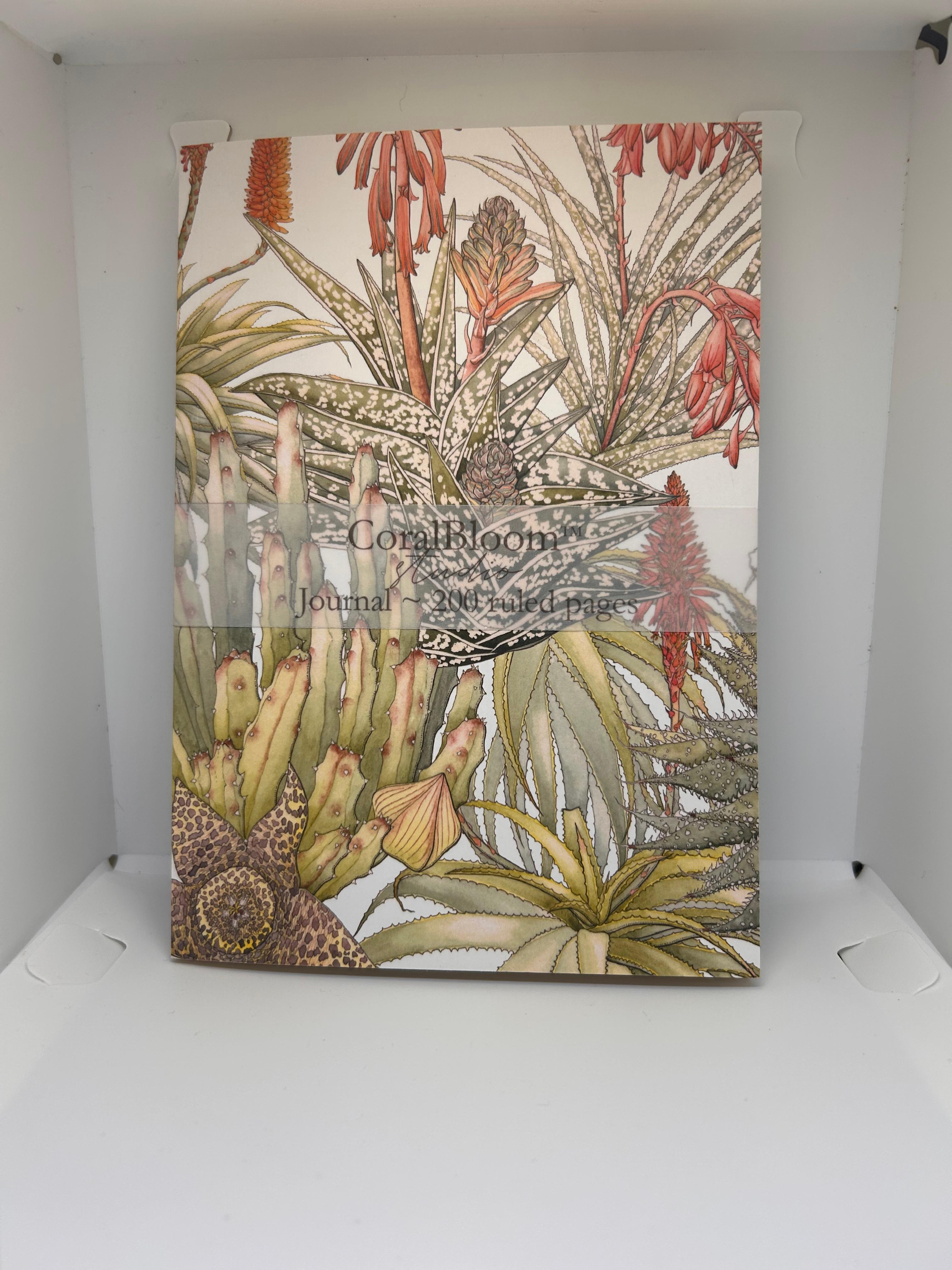 CoralBloom A5 journal with watercolour red aloes and fynbos on a pale cover