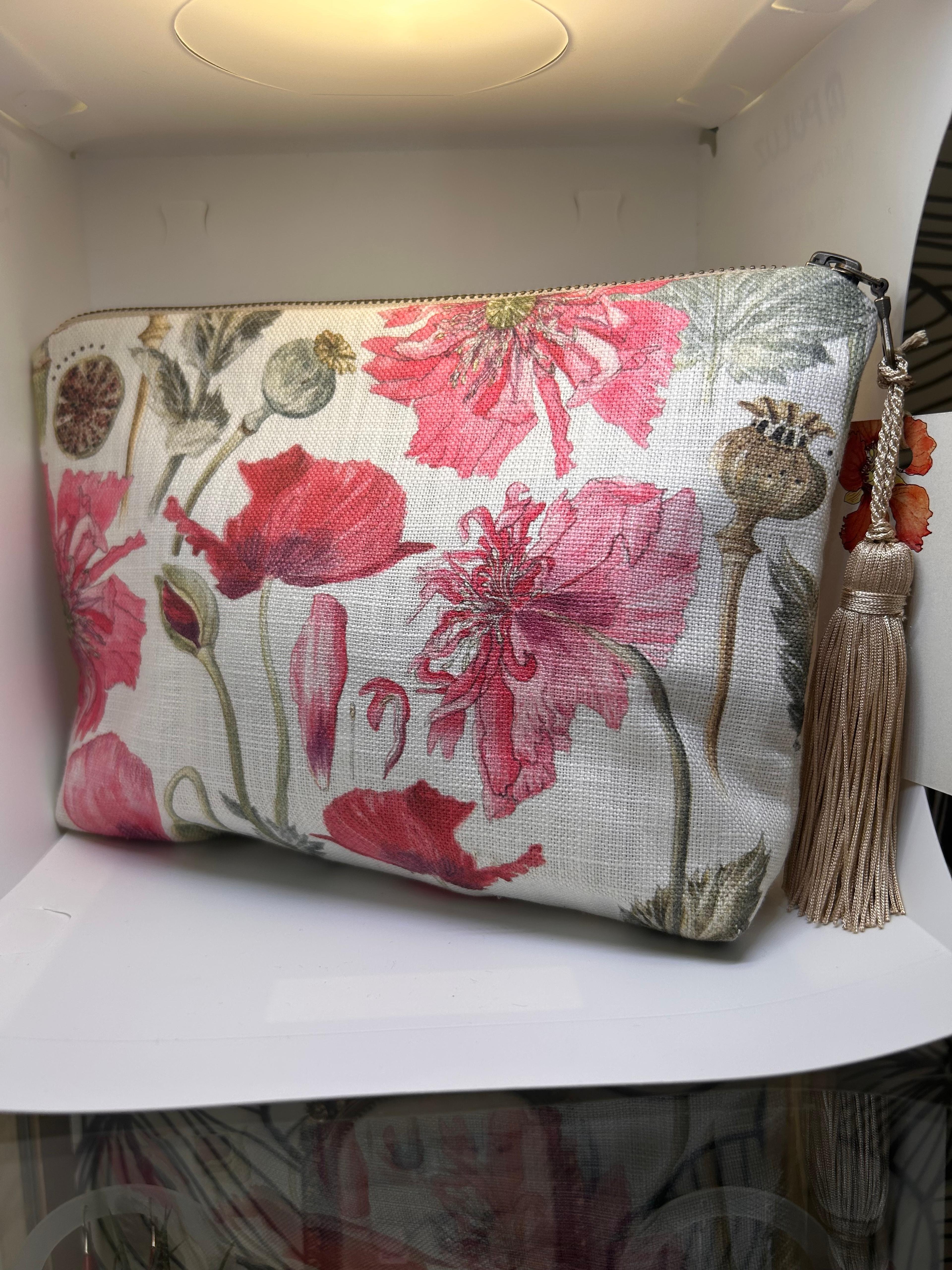 Cream CoralBloom tassel clutch bag printed with watercolour red and pink poppies and seed heads