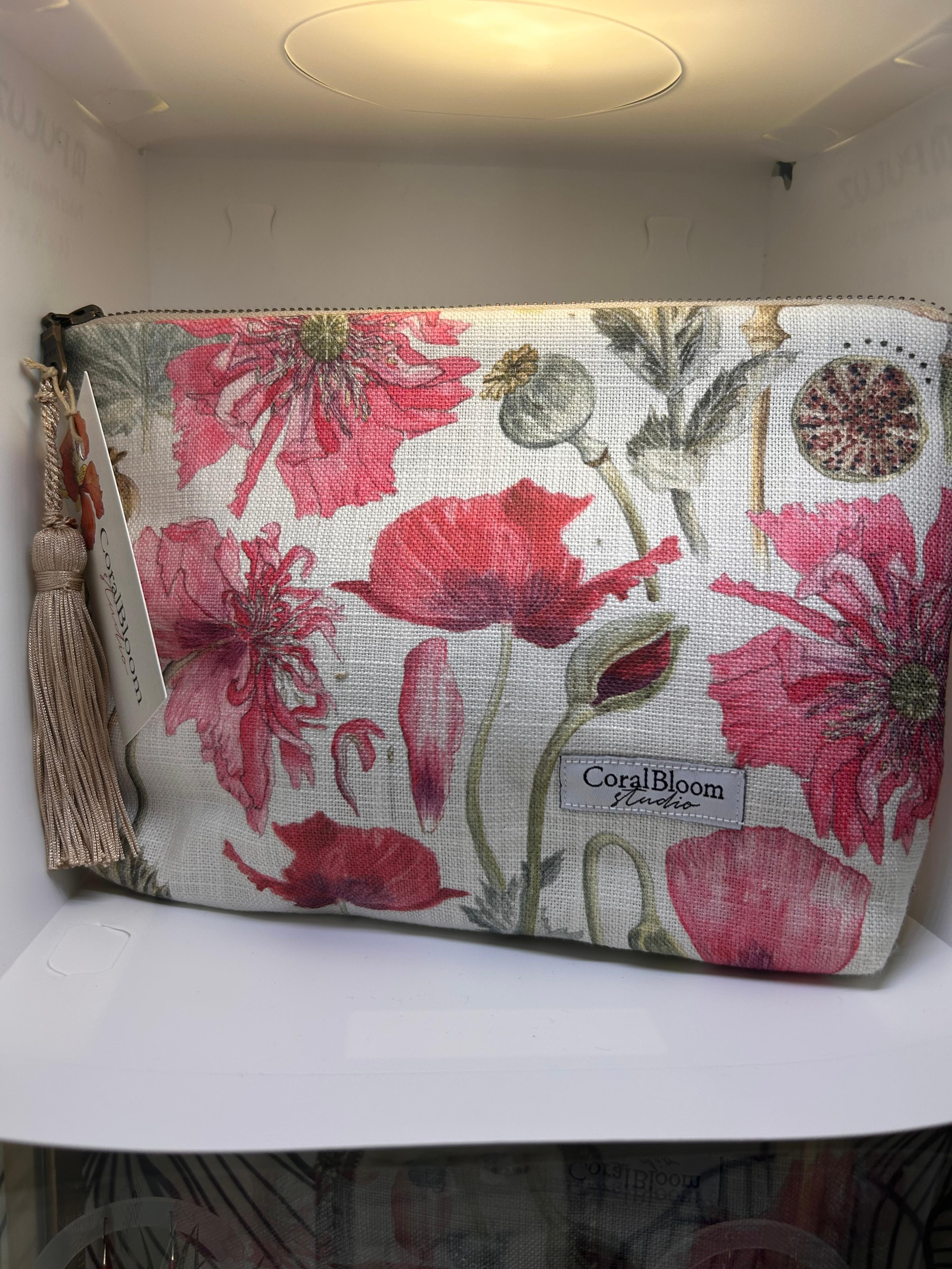 Cream CoralBloom tassel clutch bag printed with watercolour red and pink poppies and seed heads