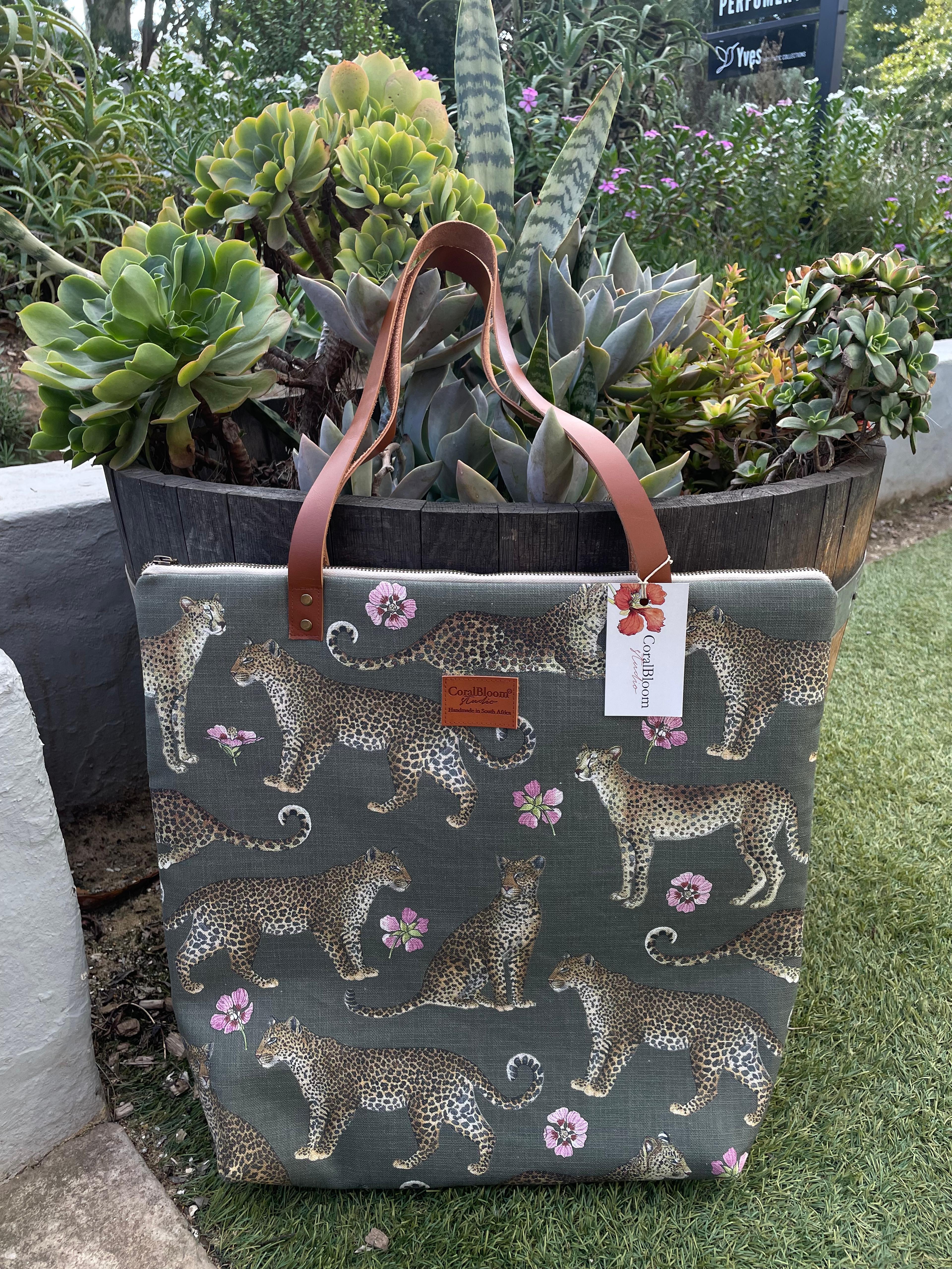 Sage green CoralBloom luxury tote bag printed with a repeating watercolour leopard and pink flower pattern