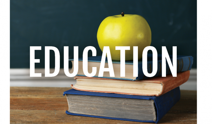 EDUCATION in white letters over a green apple on a stack of books.
