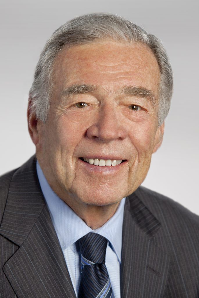 Headshot of Jack Diepenbrock in a dark suit and striped tie.