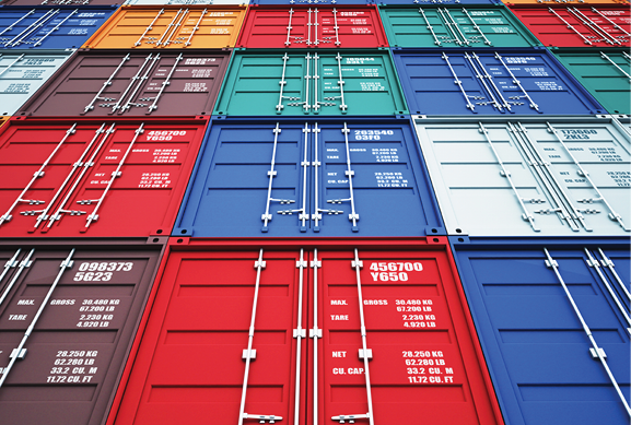 Rows of colorful shipping container doors in red, blue, orange and teal.