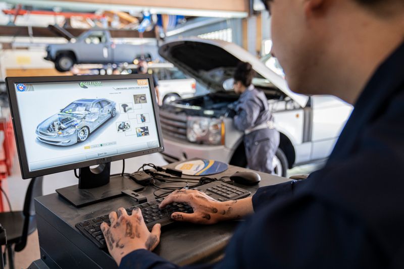 Automotive technology students perform vehicle diagnostics (May 13, 2021). Photo courtesy California Community Colleges.