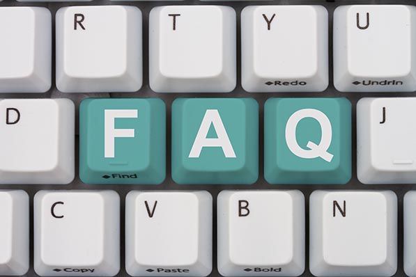 Teal keyboard keys spell FAQ among white keys.