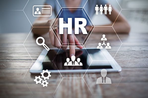 A hand touches a tablet beneath HR text and connected human resources icons.