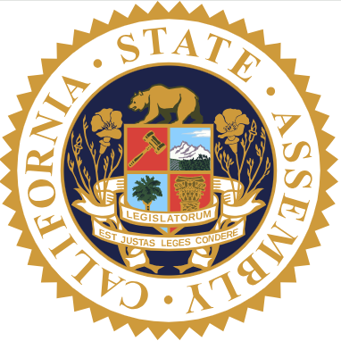 Gold California State Assembly seal with a multicolored central shield.