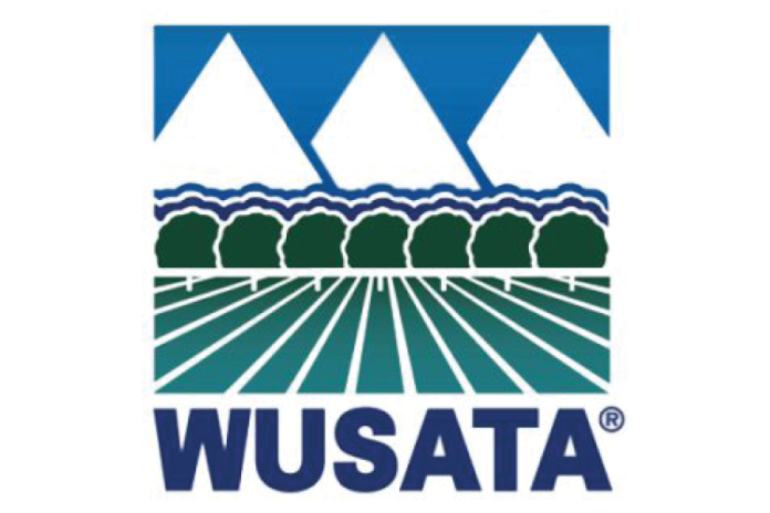 WUSATA logo with stylized mountains, waves, trees and cultivated fields.