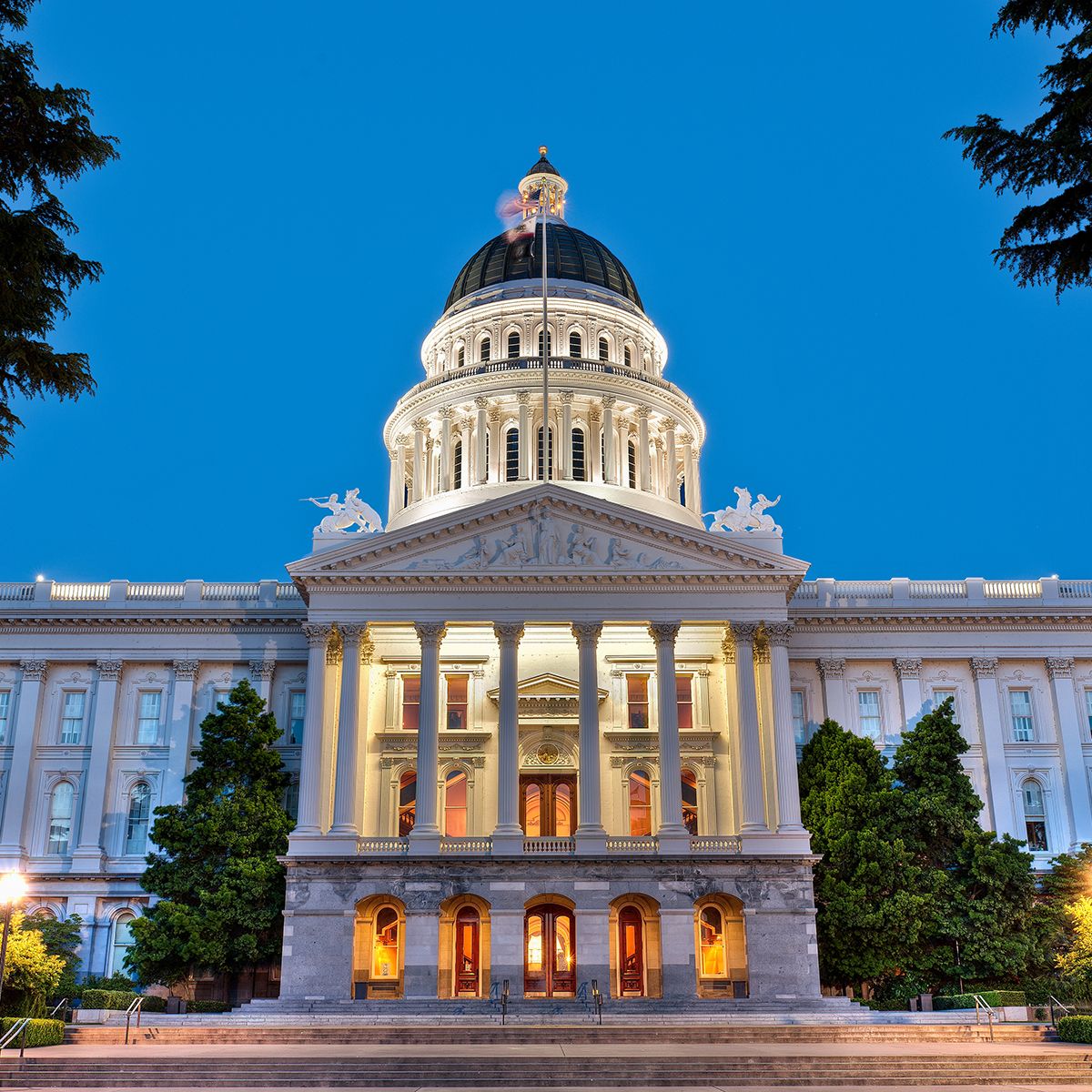California State Capitol building illuminated at night.