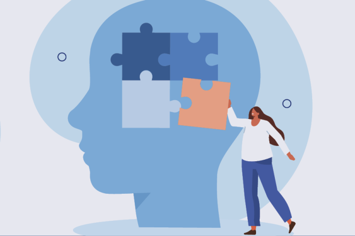 Illustration of a woman placing a puzzle piece into a large blue head silhouette.