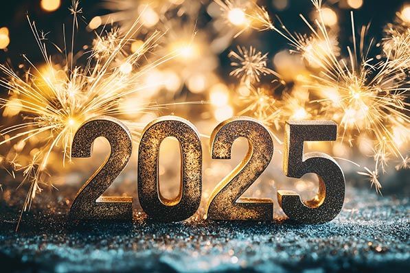 Glittering gold numerals 2025 surrounded by sparklers and warm lights.