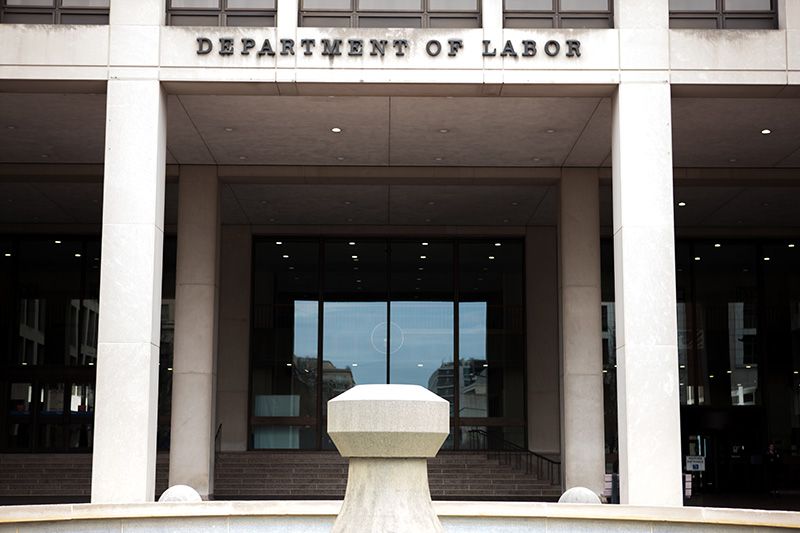 The columned entrance of a building labeled DEPARTMENT OF LABOR.