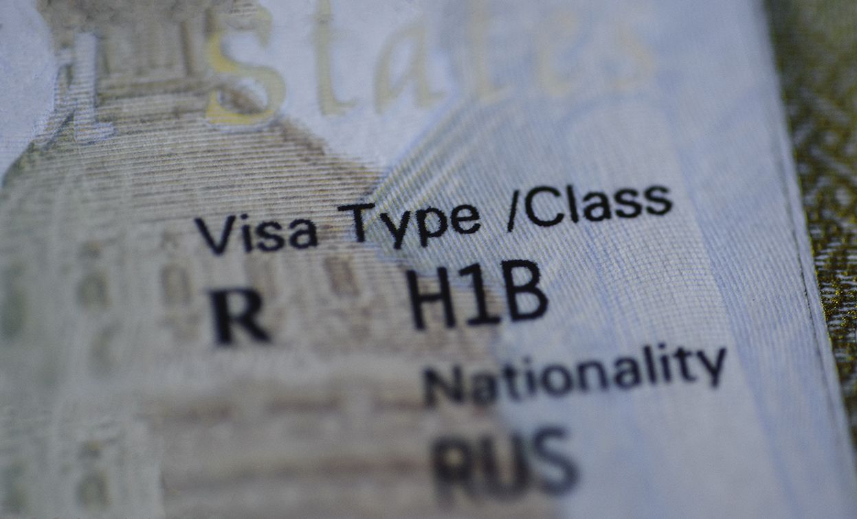 Close-up of a visa showing Visa Type/Class R H1B.