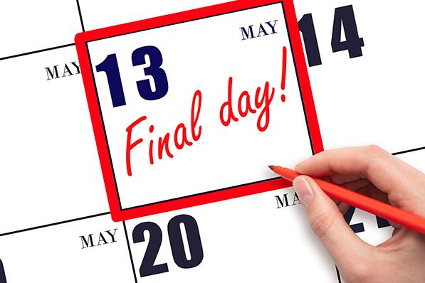 May 13 marked Final Day in red on a calendar, with a hand holding a red pencil.